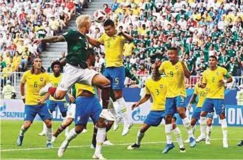  ?? AP ?? Brazil’s defensive midfielder Casemiro intercepts an aerial ball during the round of 16 match against Mexico. Brazil have conceded just four shots on target in four matches up to now.