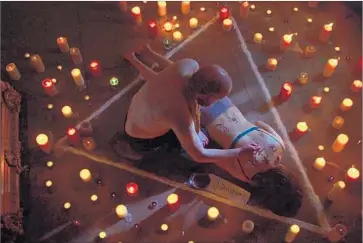  ?? Samson Films / IFC Films ?? STEVE ORAM inscribes occult symbols on Catherine Walker in a scene from Liam Gavin’s “Dark Song.”