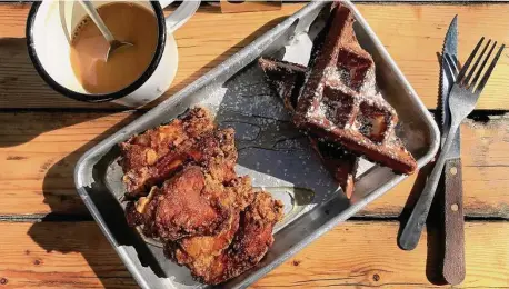  ?? Paul Stephen/Staff ?? Cullum’s Attagirl: Fried chicken pairs perfectly with a crisp yet tender buttermilk waffle.