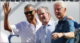  ?? ROB CARR, GETTY IMAGES ?? Former U.S. presidents Barack Obama, George W. Bush and Bill Clinton attend the trophy presentati­on prior to Thursday’s foursome matches at the Presidents Cup in New Jersey.