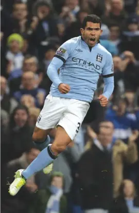  ??  ?? Carlos Tevez celebrates after scoring the winner for Man City against Swansea Photograph:AP