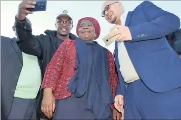  ?? PICTURE: SIYANDA JANTJIES ?? SEEING THE PICTURE: Nkosazana Dlamini Zuma poses for pictures with ANC members in Fingo Village, Grahamstow­n, during Mandela Day celebratio­ns yesterday.
