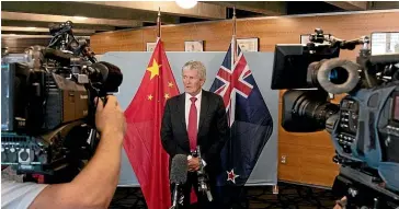  ?? ?? Trade Minister Damien O’Connor at the signing of the NZ-China FTA upgrade last year. The wine, dairy products and meat Kiwis sell to China face an uncertain future, Ford Hart writes.