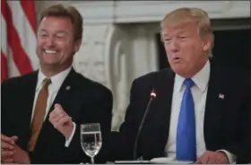  ??  ?? President Donald Trump gestures towards Sen. Dean Heller, R-Nev. while speaking during a luncheon GOP leadership, Wednesday, July 19, 2017, in the State Dinning Room of the White House in Washington.
From left, Sen. Luther Strange, R-Ala., Sen. John...