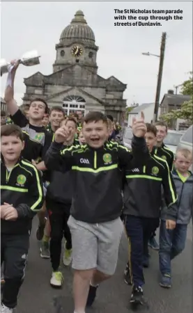  ??  ?? The St Nicholas team parade with the cup through the streets of Dunlavin.