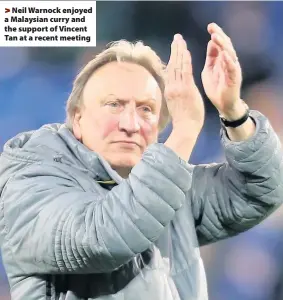  ??  ?? > Neil Warnock enjoyed a Malaysian curry and the support of Vincent Tan at a recent meeting