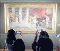  ?? PHOTO BY J. GERARD SEGUIA ?? LAST DAY
Visitors take photos of Juan Luna’s ‘Hymen! O Hymenee!’ at the Ayala Museum on Sunday, March 24, 2024, the last day of the ‘Spendor: Juan Luna, Painter as Hero’ exhibit. The painting is on loan to the museum.