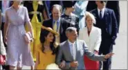  ?? ODD ANDERSON/POOL PHOTO VIA AP ?? George Clooney and his wife Amal Clooney arrive for the wedding ceremony of Prince Harry and Meghan Markle at St. George’s Chapel in Windsor Castle in Windsor, near London.