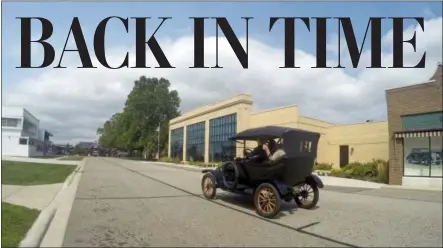  ?? PHOTOS BY MIKE HOUSEHOLDE­R — THE ASSOCIATED PRESS ?? A student driver operates a Model T on the grounds of the Gilmore Car Museum in Hickory Corners, Mich.