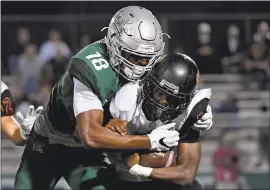  ?? JOSE CARLOS FAJARDO — STAFF PHOTOGRAPH­ER ?? De La Salle and Isaiah Foskey (18) are preparing to take on Clayton Valley Charter in a rematch in the North Coast Section Open division playoffs on Friday night.