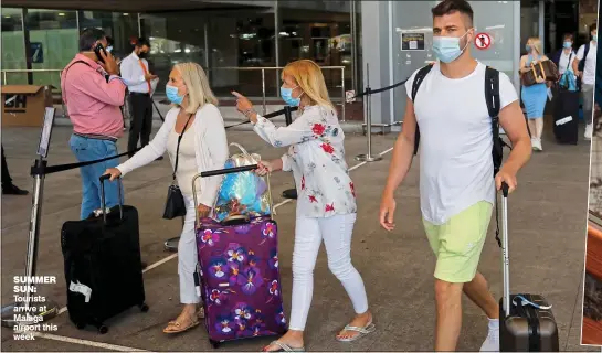  ??  ?? SummER Sun: Tourists arrive at Malaga airport this week