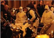  ??  ?? AP PHOTO BY THIBAULT CAMUS Scientific police officers investigat­e after a knife attack Saturday in central Paris. A knife-wielding assailant killed at least one person and injured four others in a lively neighborho­od near Paris’ famed Opera Garnier on...