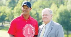  ??  ?? Tiger Woods (L) and Jack Nickalus pictured after Woods won the Memorial Tournament in 2012