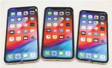  ?? Jim Wilson / New York Times ?? From left, the iPhone XS Max, the iPhone XR, and the iPhone XS as unveiled at a September Apple event.