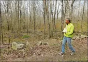  ?? DANA JENSEN THE DAY ?? David Stygar of the Avalonia Land Trust walks along a dirt road on the property in Preston.