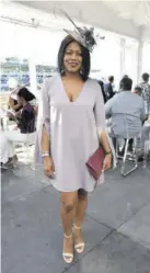  ??  ?? attorney-at-law Jan Gordon really made this cement grey Misguided dress come to life with her strut, smile and Khalil’s Hatitude &amp; Kloset hat.