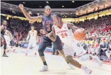  ?? ROBERTO E. ROSALES/JOURNAL ?? New Mexico State’s Chancellor Ellis (3) defends UNM’s Damien Jefferson during a November game in the Pit. Leaving the WAC doesn’t seem to interest NMSU right now.