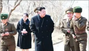  ?? KNS/KCNA/AFP ?? This undated picture shows North Korean leader Kim Jong-un (centre) inspecting the Sin Islet defence company in Kangwon province with his youngest sister Kim Yo-jong (second left).