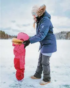  ?? Courtesy of Liisi Hatinen ?? Liisi Hatinen teaches her daughter how to ice skate on Lake Kuolimo. “Everybody has access to the basics,” she says.