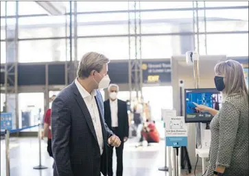  ?? Los Angeles World Airports ?? UNDER THE pilot program, departing fliers who have a temperatur­e of 100.4 degrees or higher will be advised not to travel — but not prevented from it. Arriving internatio­nal passengers may be asked to quarantine.