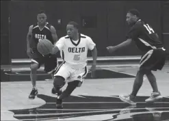  ?? MIKE BUSH/NEWS-SENTINEL ?? Former Elliot Christian boys basketball player Jalen Valverde slices past two Team Black players in the High School All-Stars basketball game at Delta College on Friday.