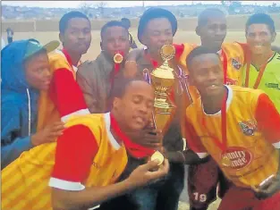  ??  ?? ON THE MOVE: Players from Zwelitsha’s Barcelona FC display their medals as they celebrate their victory in the final match of the SAB league playoffs at Zwelitsha Stadium. The club now plans to hire a profession­al coach