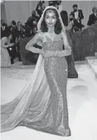  ?? EVAN AGOSTINI/INVISION ?? Yara Shahidi evokes Josephine Baker in a Dior gown.