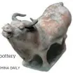  ?? JIANG DONG / CHINA DAILY ?? A seventhcen­tury ox pottery figurine.