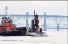  ?? Chief Petty Officer Joshua Karst / Submarine Readiness Squadron ?? The Virginia-class submarine USS Minnesota heads up the Thames River toward Groton in November.
