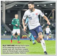  ??  ?? SLO TORTURE Michal Duris races off to celebrate his extra-time winner and, left, Northern Ireland boss Ian Baraclough congratula­tes Slovakia coach Stefan Tarkovic