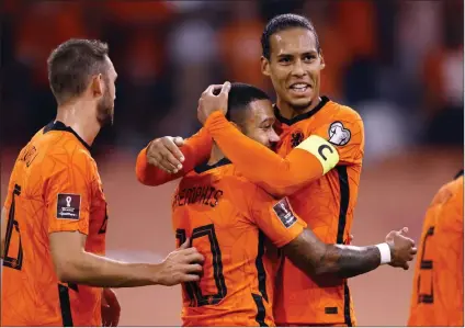  ?? Photo: The Straight Times. ?? Not satisfied… Memphis Depay scored a hat-trick as the Netherland­s ran out 6-1 winners over 10-man Turkey at the Amsterdam Arena on Tuesday to go top of World Cup qualifying Group G.