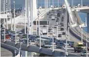  ?? Paul Chinn / The Chronicle ?? A westbound AC Transit bus approaches the Yerba Buena Island tunnel on the Bay Bridge on Jan. 10.