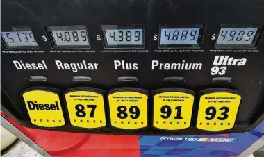  ?? ?? The pumps at Soundview Servicente­r North in Old Greenwich display the lowered prices at the start of the state's gas tax holiday last spring. The state gradually began restoring the 25-cents-per-gallon tax starting Jan. 1.