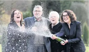  ??  ?? Dennis Banfield celebrates his lottery win with his wife and daughters in 2018