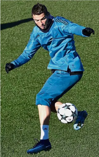  ?? — AFP ?? Hard at work: Real Madrid forward Cristiano Ronaldo training at the Valdebebas Sport City in Madrid on Tuesday.