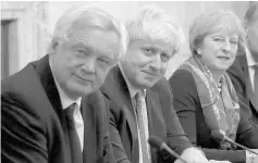  ?? — AFP photo ?? File photo shows May (right) with Davis (left) and Johnson in the Cabinet Room inside 10 Downing Street.