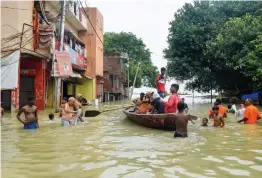  ?? — PTI ?? Flooded Daraganj area due to rise in the water level of the river Ganga following heavy rains in Prayagraj on Sunday.