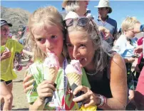  ??  ?? Treat time . . . Enjoying a strawberry gelato after the race are Wanaka Primary School pupil Charlotte Howard (7) and her mother Sophie Dalziel, both of Wanaka.