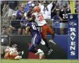  ?? GAIL BURTON — THE ASSOCIATED PRESS ?? Browns defensive back Jermaine Whitehead intercepts a pass intended for Ravens tight end Mark Andrews during the second half Sept. 29 in Baltimore.