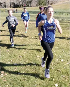  ?? NEWS PHOTO RYAN MCCRACKEN ?? Zaynna Willoughby leads a group of bantam runners off the starting line during a race at the Medicine Hat Panthers Track and Field Club cross country meet on Saturday at Kin Coulee Park.