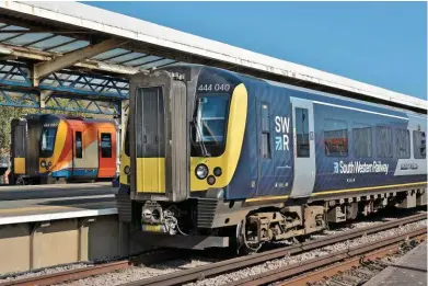  ?? GINN. STEPHEN ?? South Western Railway 444040 THE D-DAY STORY stands at Weymouth on August 11 2019. SWR was one of only two operators to cover their share of train and infrastruc­ture costs (the other was c2c).