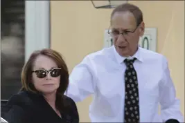  ?? CARL JUSTE — MIAMI HERALD VIA AP ?? Shirley Sotloff and her husband, Arthur B. Sotloff, exit a car as they return home after a memorial service for their son, slain journalist Steven Sotloff, at Temple Beth Am, on Sept. 5, 2014, in Pinecrest, Fla.