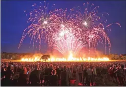  ?? Associated Press photos ?? Fireworks explode during the Lucy in the Sky event "Suspended Time" in Camp Hill, Liverpool, England, to mark the 50th anniversar­y Thursday of the release of "Sgt. Pepper's Lonely Hearts Club Band" by The Beatles..