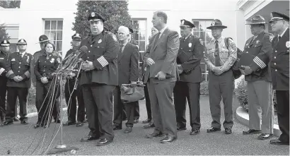  ?? CAROLYN KASTER/ASSOCIATED PRESS ?? Gloucester, Mass., Police Chief Leonard Campanello, joined by other members of law enforcemen­t from around the country, talks to media outside the White House on July 6, 2016, after meeting with senior Obama administra­tion officials to discuss the...