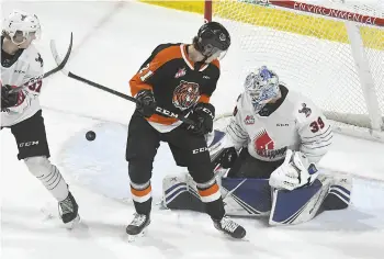  ??  ?? Moose Jaw Warriors goaltender Brock Gould, here in action against the Medicine Hat Tigers earlier this season, turned in a stellar performanc­e in a losing effort against Spokane.