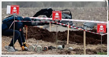  ?? ?? BRAVE: Mine-clearing near the city of Brovary last week. Above right: The Trust’s Ukraine manager Mairi Cunningham