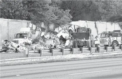  ?? JEFFREY F. BILL/BALTIMORE SUN ?? A tractor-trailer crash and fire blocked southbound traffic Friday morning on I-95 near Md. 100 in Howard County. The fire was extinguish­ed but reignited, contributi­ng to traffic delays. No injuries were reported.