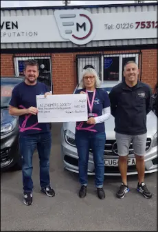  ?? ?? Left: Robert Blackburn, left, presents a cheque to the Alzheimer’s Society.