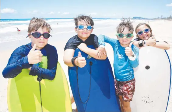  ?? Picture: Tertius Pickard ?? Siblings Tom, Ollie, Harriet, and Harvey make the most of the sunny weather on the Gold Coast.
