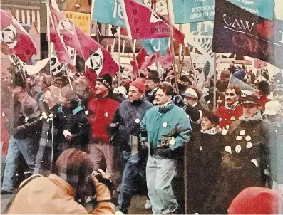  ?? HAMILTON SPECTATOR FILE PHOTO ?? Demonstrat­ors including Wayne Marston, left, Andrea Horwath, Ontario Federation of Labour president Gord Wilson (middle, blue coat) and MPP Dave Christophe­rson (green jacket) march on James Street North during “Hamilton Action Days” in February 1996.